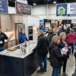 Homeowners exploring kitchen remodeling displays and speaking with local contractors at the Fairgrounds Southern Ideal Home Show 2026 inside the North Carolina State Fairgrounds in Raleigh