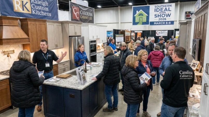 Homeowners exploring kitchen remodeling displays and speaking with local contractors at the Fairgrounds Southern Ideal Home Show 2026 inside the North Carolina State Fairgrounds in Raleigh