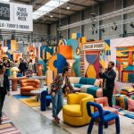Visitors exploring a vibrant, colorful design installation at Maison & Objet Paris 2026 during Paris Design Week, with bold furniture and textile displays filling the exhibition hall