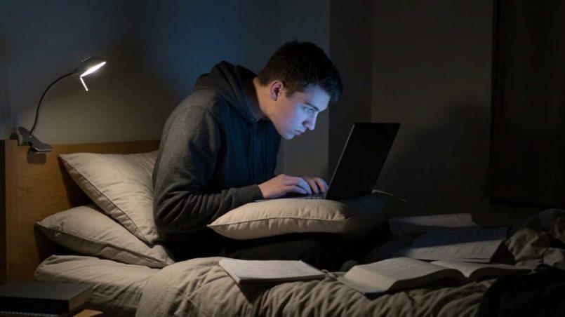 Austin college freshman adjusting pillow for neck comfort