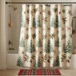 Christmas shower curtain with red and green evergreen print in a neutral bathroom