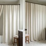 Extra-long shower curtain creating a floor-to-ceiling look in a bright bathroom