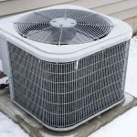 heat pump outdoor unit completely covered in thick ice during winter